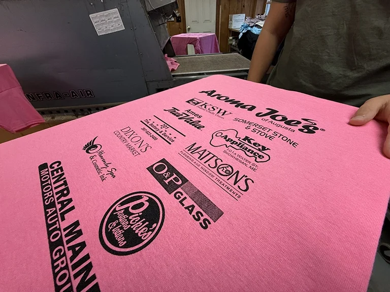 Fabric with various logos on it.